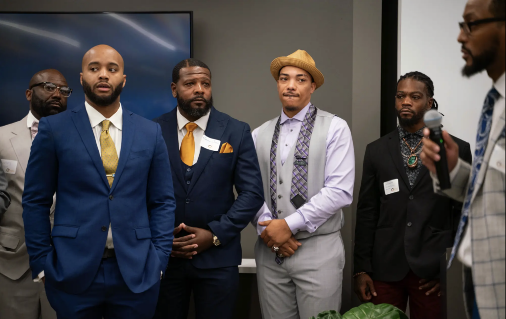 Wrongfully convicted exonerees listen as Organization of Exonerees President introduces them during the Organization of Exonerees Gala and Fundraiser at Huntington Tower in Detroit on October 2023. 
