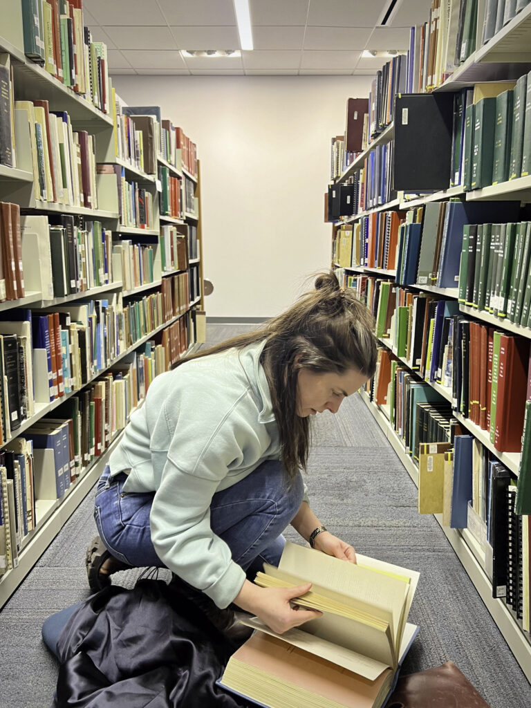 Reporter Anna Clark looks through city of Flint archives in the Gloria Coles Flint Public Library on February 22, 2024. 
